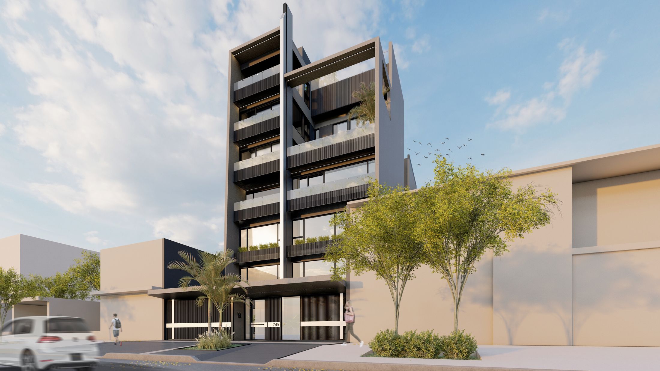 Edificio RDE en Resistencia: torre con balcones y una lámina vertical en la fachada